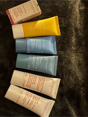 collection of Clarins Paris skincare and body care products,